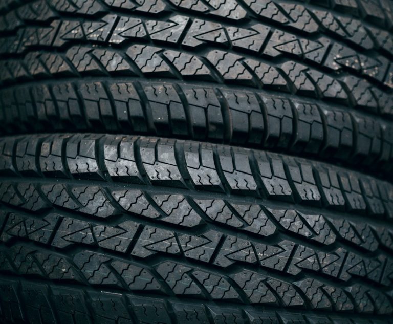 A close-up image of detailed tread on two stacked car tyres