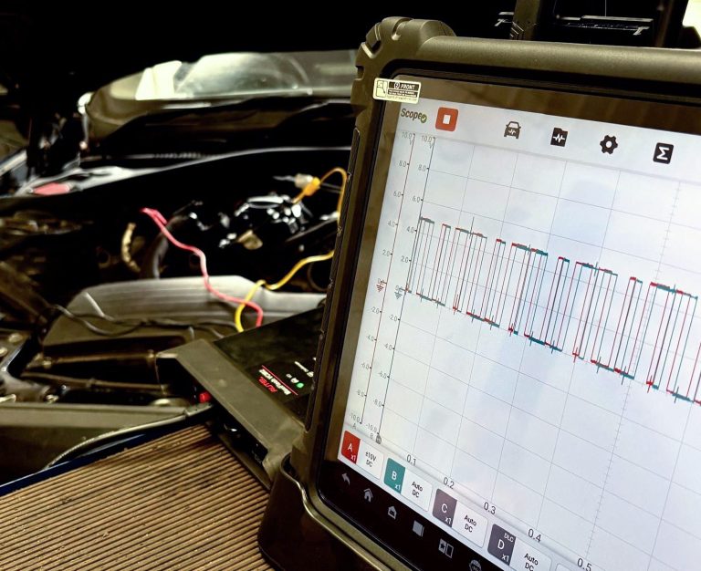 A vehicle technician using Phipps Motors' advanced diagnostic tools