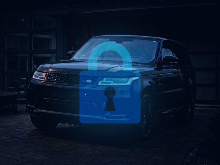 A glowing padlock hovers above a vehicle parked on a dark driveway
