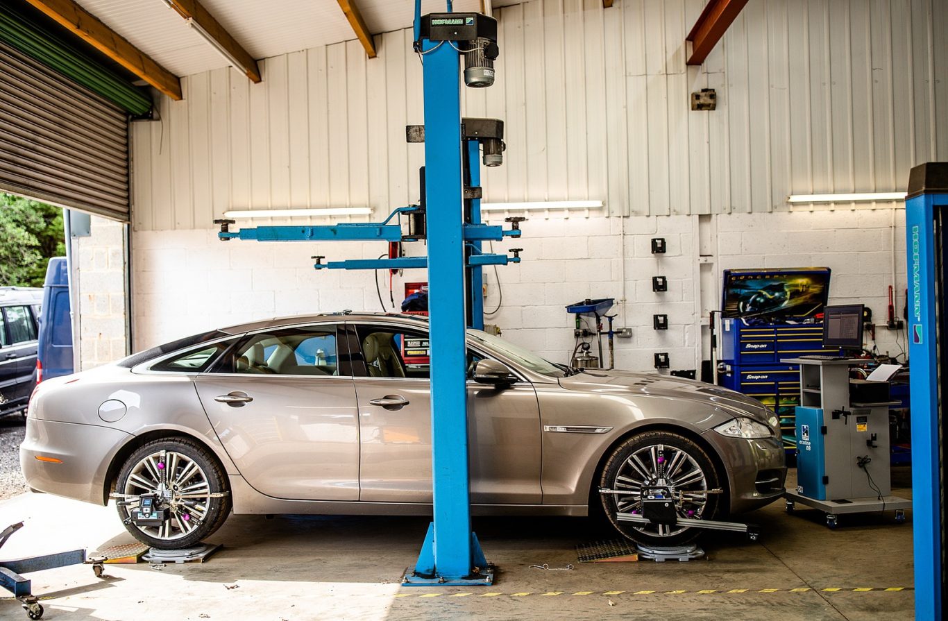 A vehicle receiving a 4-wheel alignment service at Phipps Motors