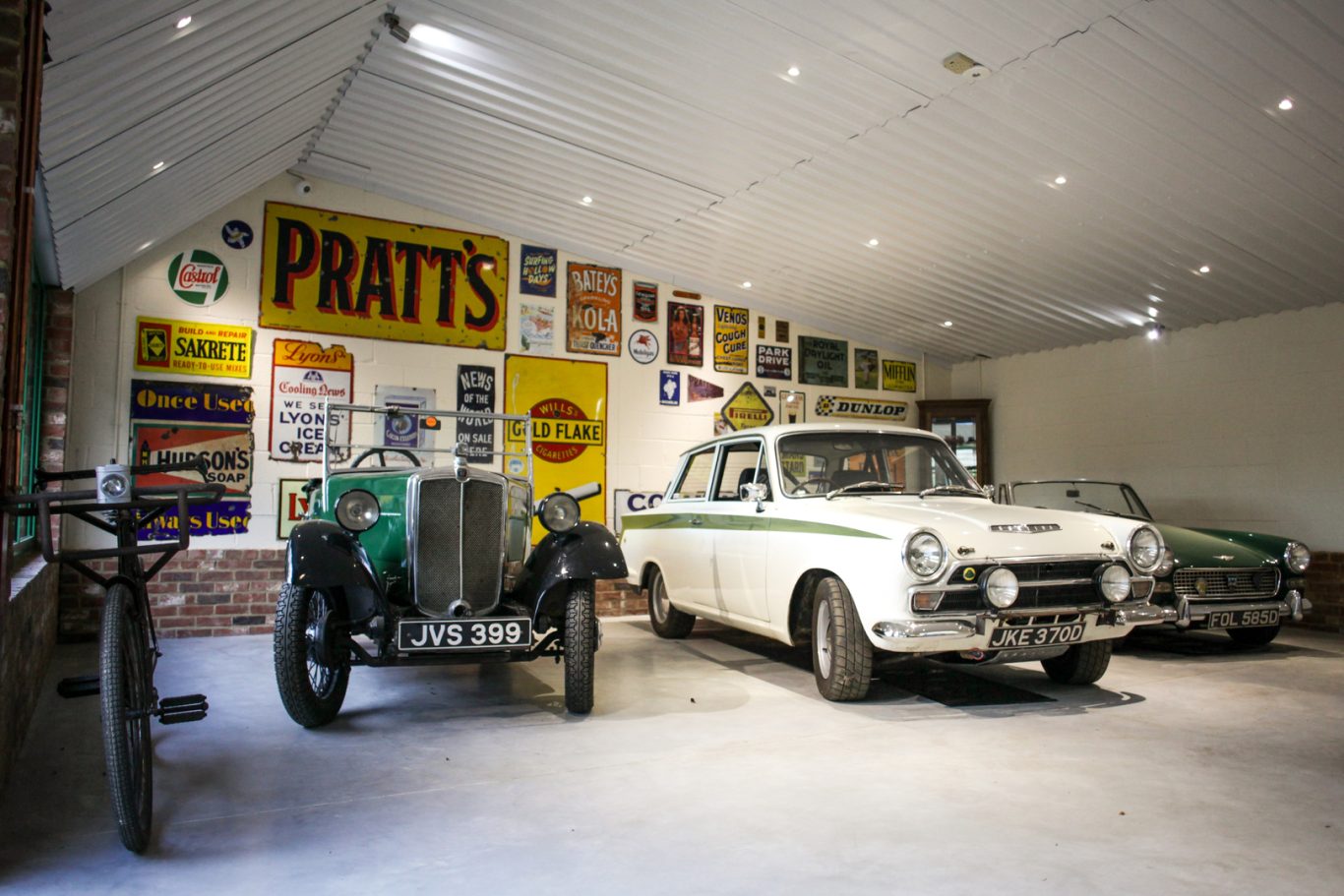 Phipps Motors Showroom The inside of the comfortable showroom at Phipps Motors showroom, where classic vehicles and vintage signs are on display.